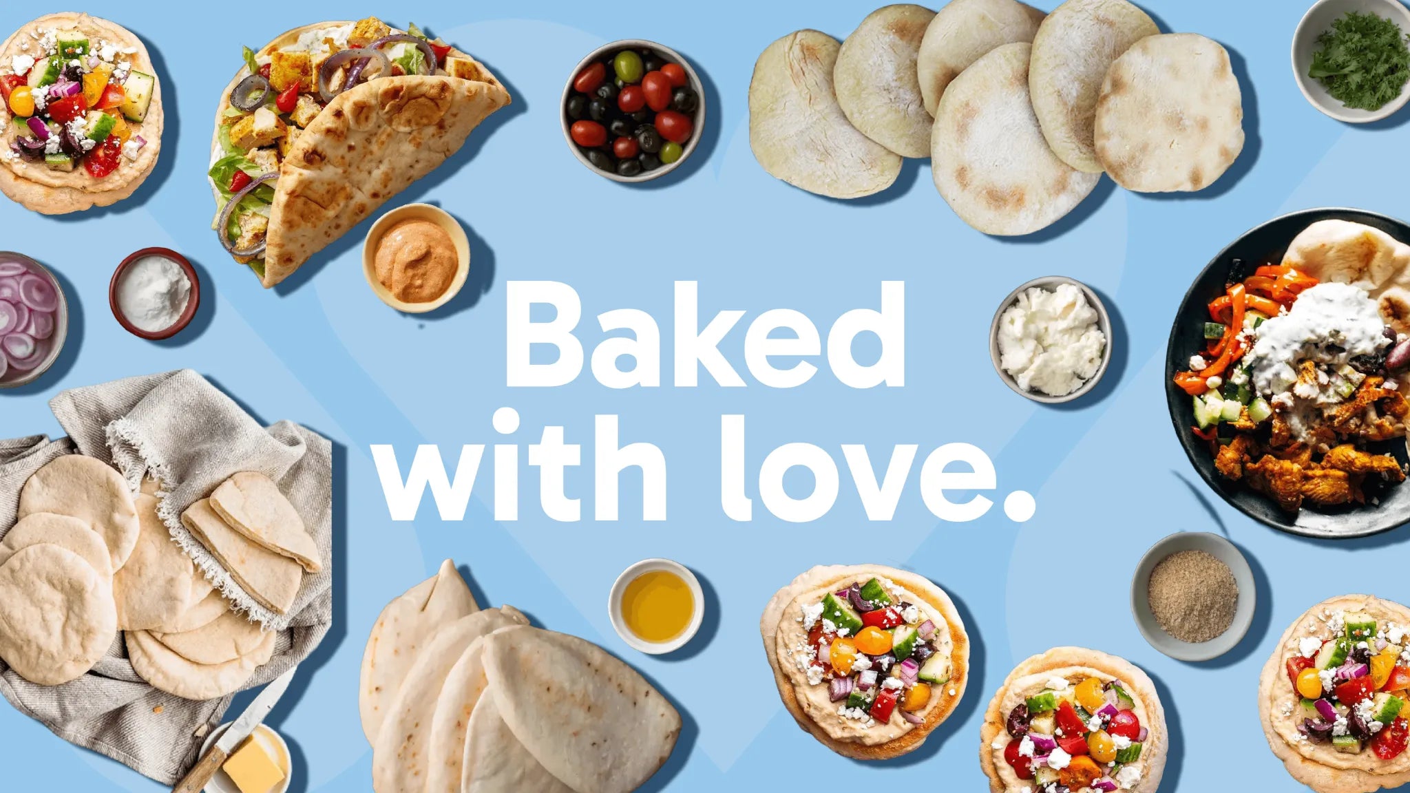 Assorted baked items including pita bread,  and bowls of toppings on a blue background with 'Baked with love.' text.